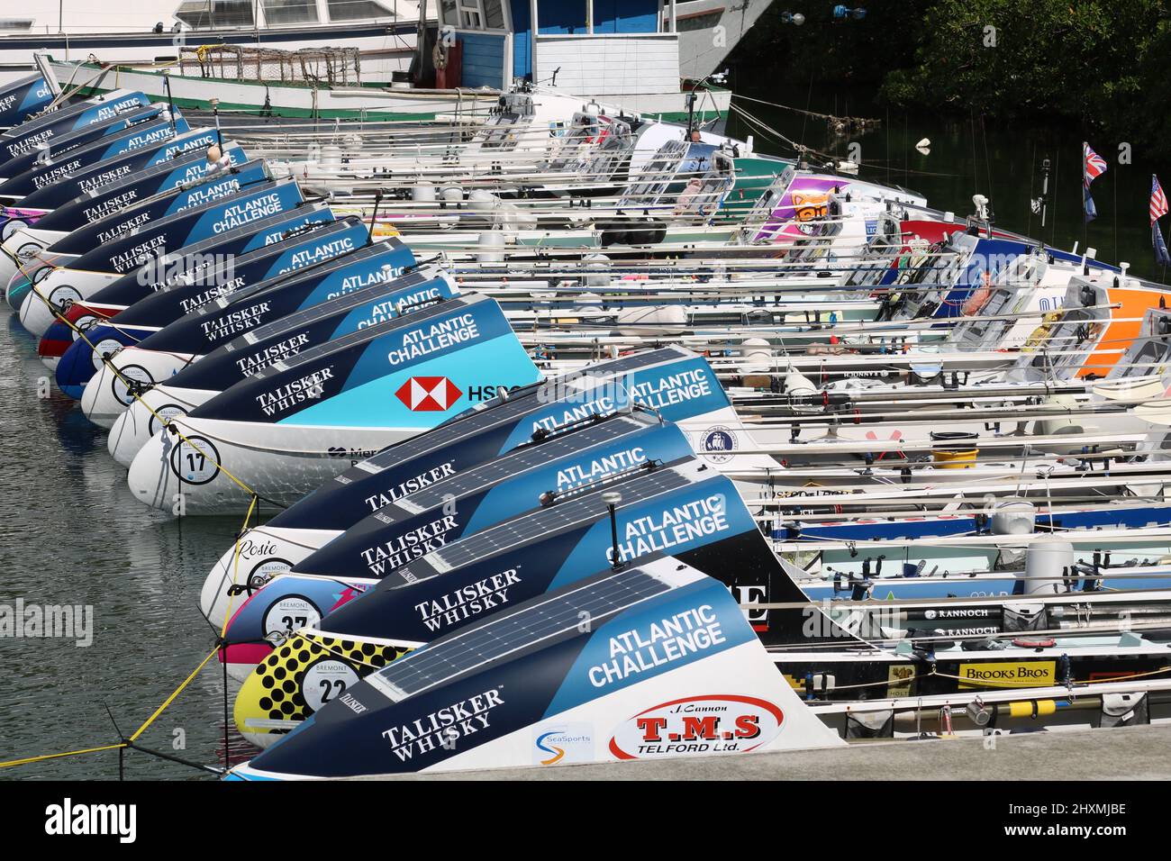 Rows of Atlantic Challenge Rowing boats awaiting transportation after the race is finished Stock Photo
