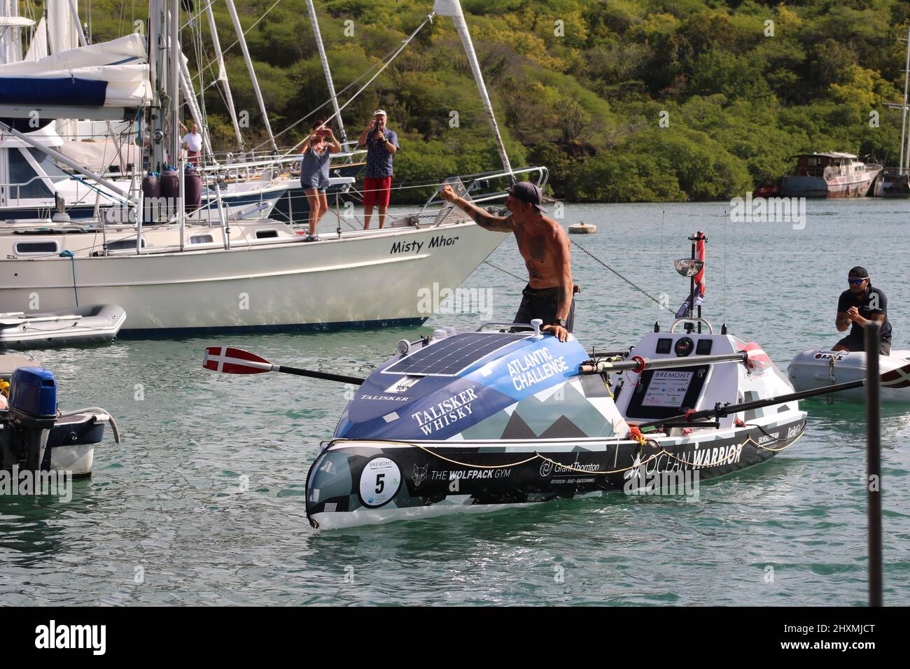 Ocean Warrior finishing Atlantic Challenge rowing race in English Harbour Antigua Stock Photo