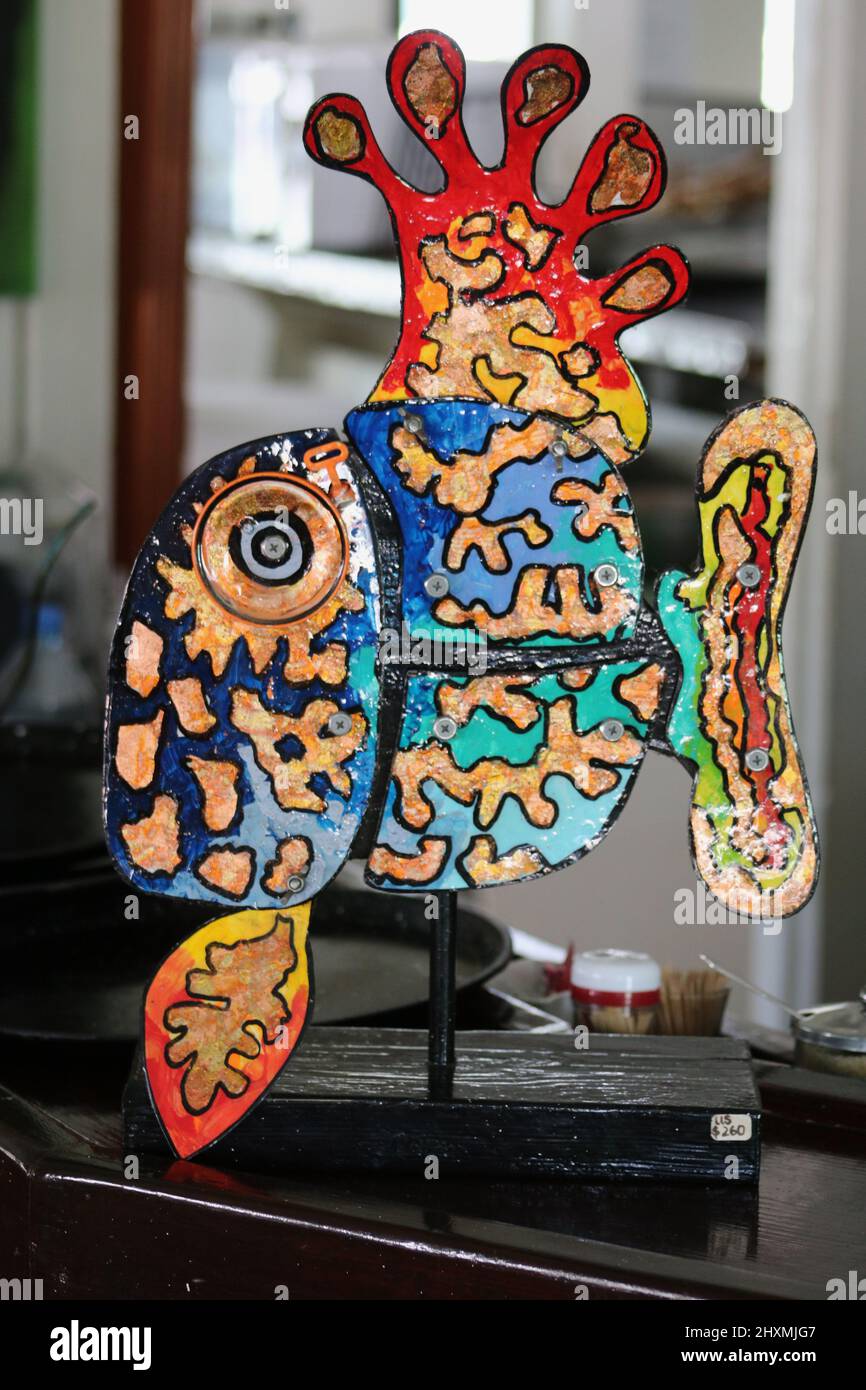 Abstract colourful flat sculpture of a tropical fish mounted on a stick Stock Photo