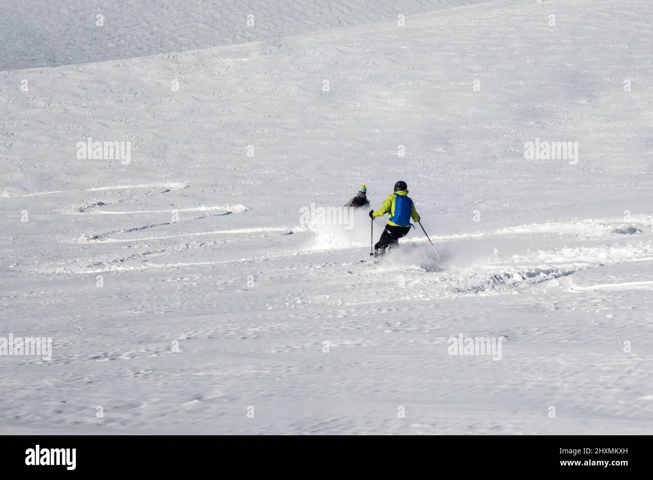 Chamonix, France - 12 February, 2022: Two female freeride skiers in winter mountain slope making first tracks in untouched snow in the Vallee Blanche Stock Photo