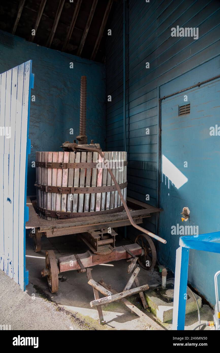 a vintage french grape press at a specialist wine merchants Stock Photo
