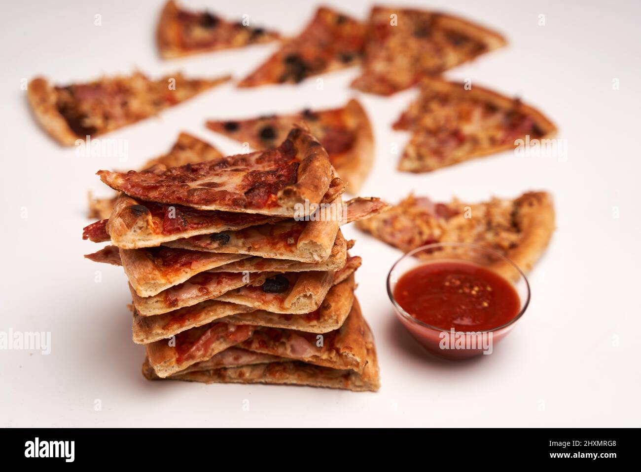 Stack of pizza slices isolated on white background Stock Photo - Alamy