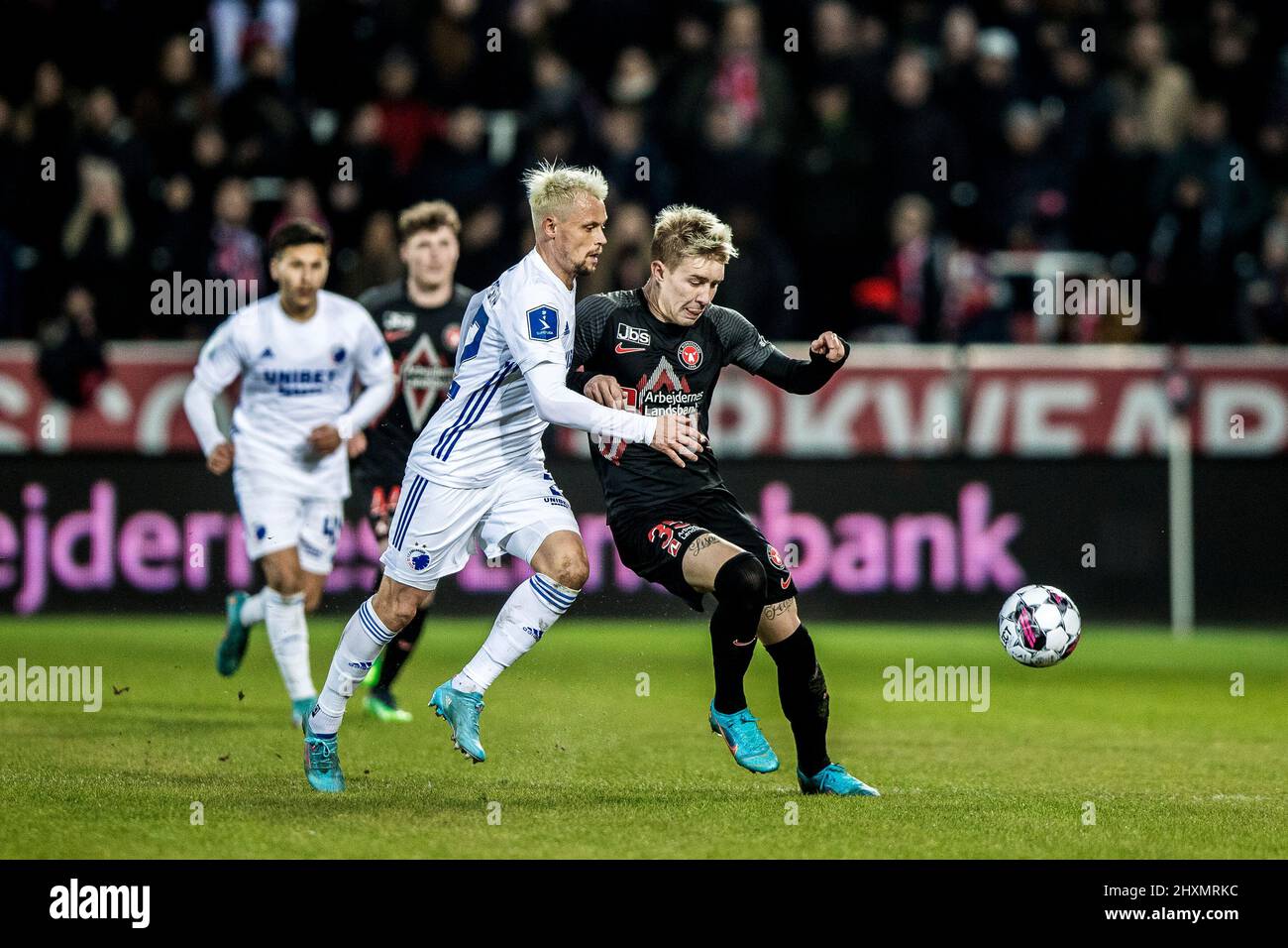 Herning, Denmark. 13th Mar, 2022. Charles (35) of FC Midtjylland and Peter Ankersen (22) of FC Copenhagen seen during the 3F Superliga match between FC Midtjylland and FC Copenhagen at MCH Arena in Herning. (Photo Credit: Gonzales Photo/Alamy Live News Stock Photo