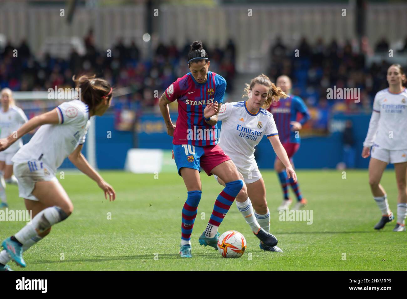 Barcelona, Spain. 13th Mar, 2022. Jenni Hermoso (L) of FC Barcelona and Teresa Abelleira (R) of Real Madrid in action during the Primera Iberdrola match between FC Barcelona Femeni and Real Madrid Femenino at Johan Cruyff Stadium. Final score; FC Barcelona Femeni 5:0 Real Madrid Femenino. (Photo by Thiago Prudencio/SOPA Images/Sipa USA) Credit: Sipa USA/Alamy Live News Stock Photo