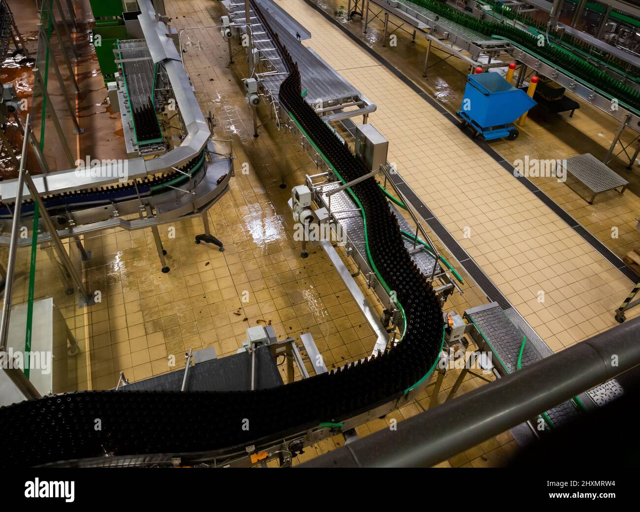 Beer bottles on bottling line Stock Photo Alamy
