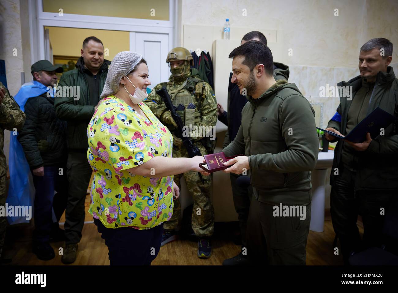 (Kyiv, Ukraine - 13.3.22) President Volodymyr Zelensky of Ukraine walks to a military hospital in Kyiv, Ukraine to visit with soldiers wounded during the Russian invasion, also awarding medals to the combatants and medical personnel for their service to their country. (Photo: Ukraine Presidential Press Office) Stock Photo
