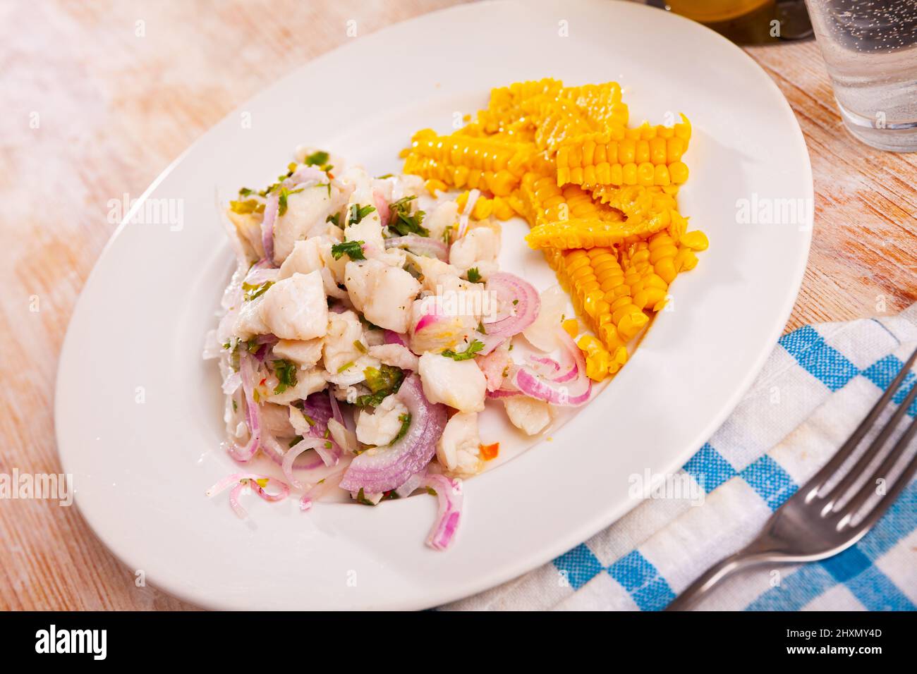 Ceviche of trout served with onion, parsley and corn Stock Photo Alamy