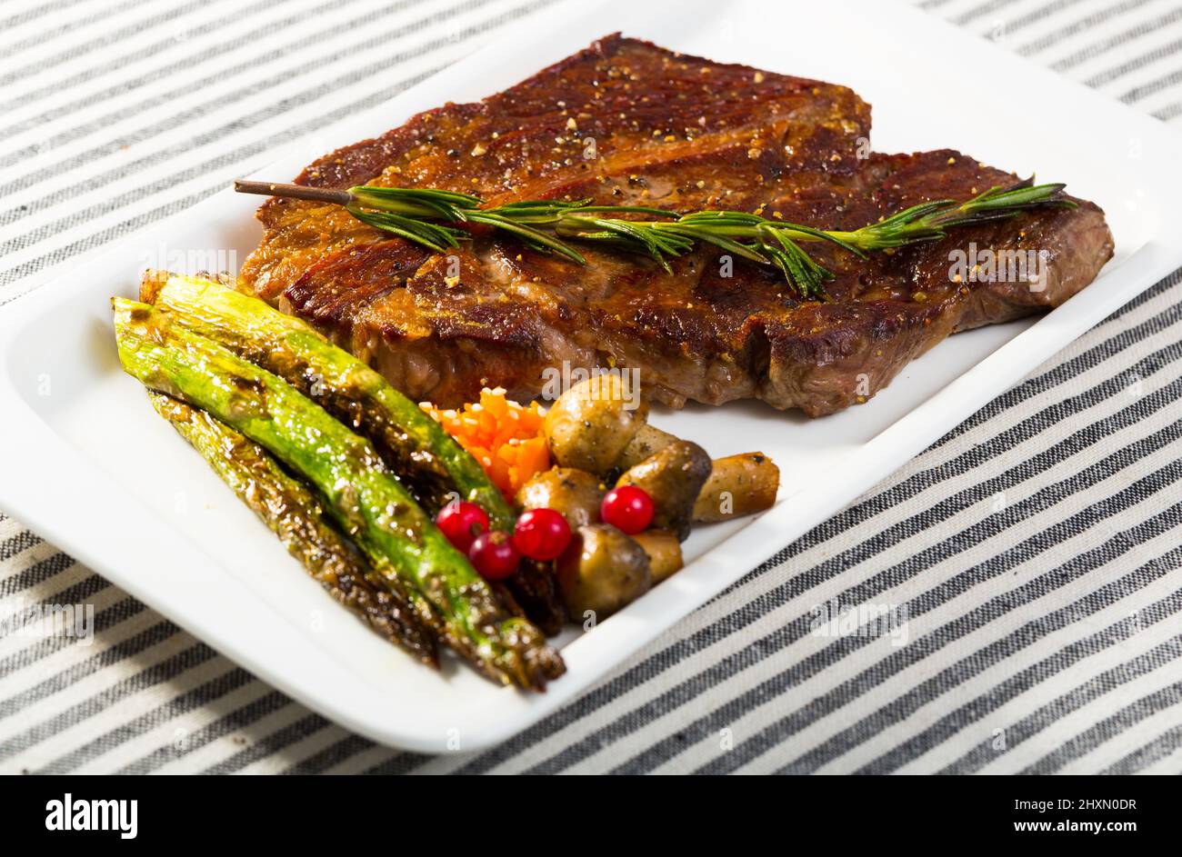 Roasted veal steak with baked vegetables Stock Photo Alamy