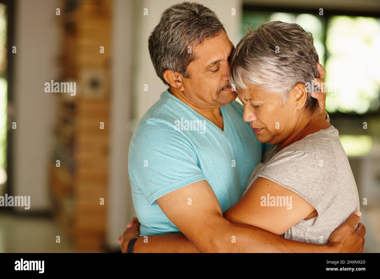 Ive always got you.... Shot of a mature couple embracing at home. Stock Photo