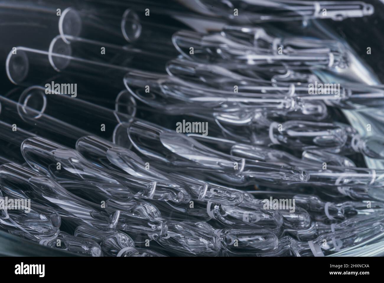 Glass medical ampoule vial for injection. Medicine is liquid sodium