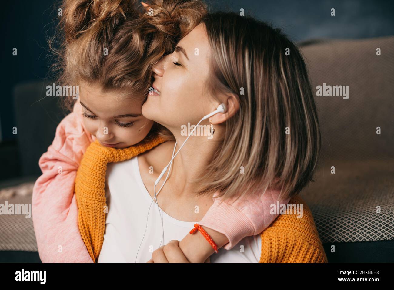 Loving young adult daughter makes an unexpected surprise to her mature  attractive mom, gives her a gift. Friendship of mom and daughter Stock  Photo - Alamy