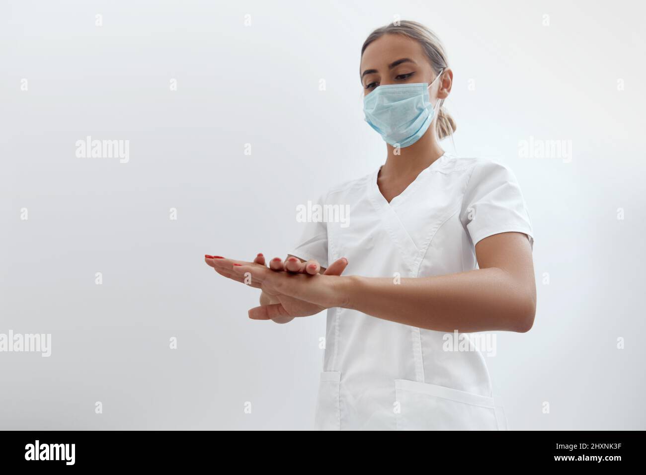 Close Up Of Medical Staff Washing Hands.Disinfect their Hands Before Surgery. Stock Photo