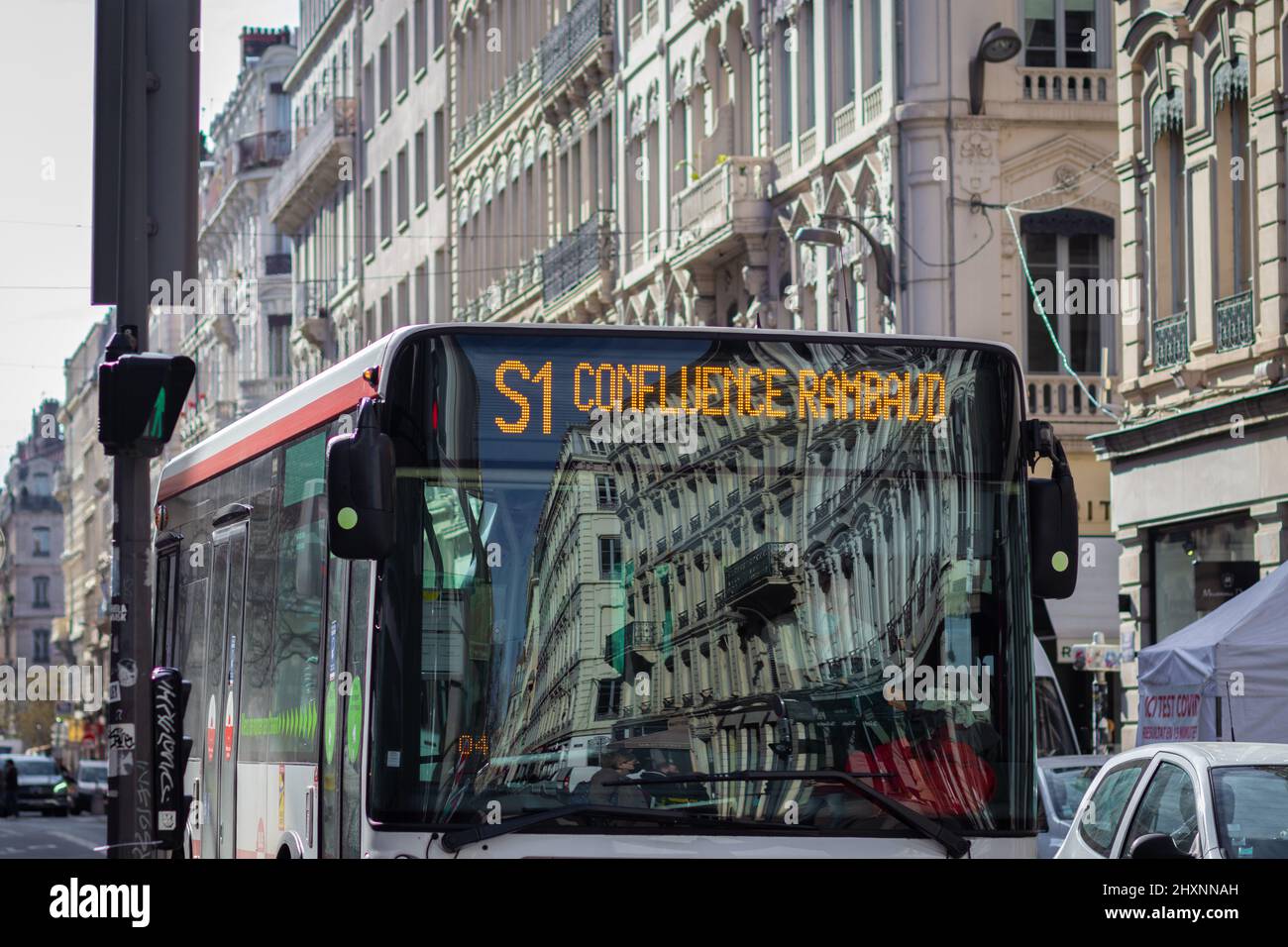 lyon- france. 18-02-2022. A public bus travels in the old city of Lyon - France - against the backdrop of the magnificent buildings. Stock Photo