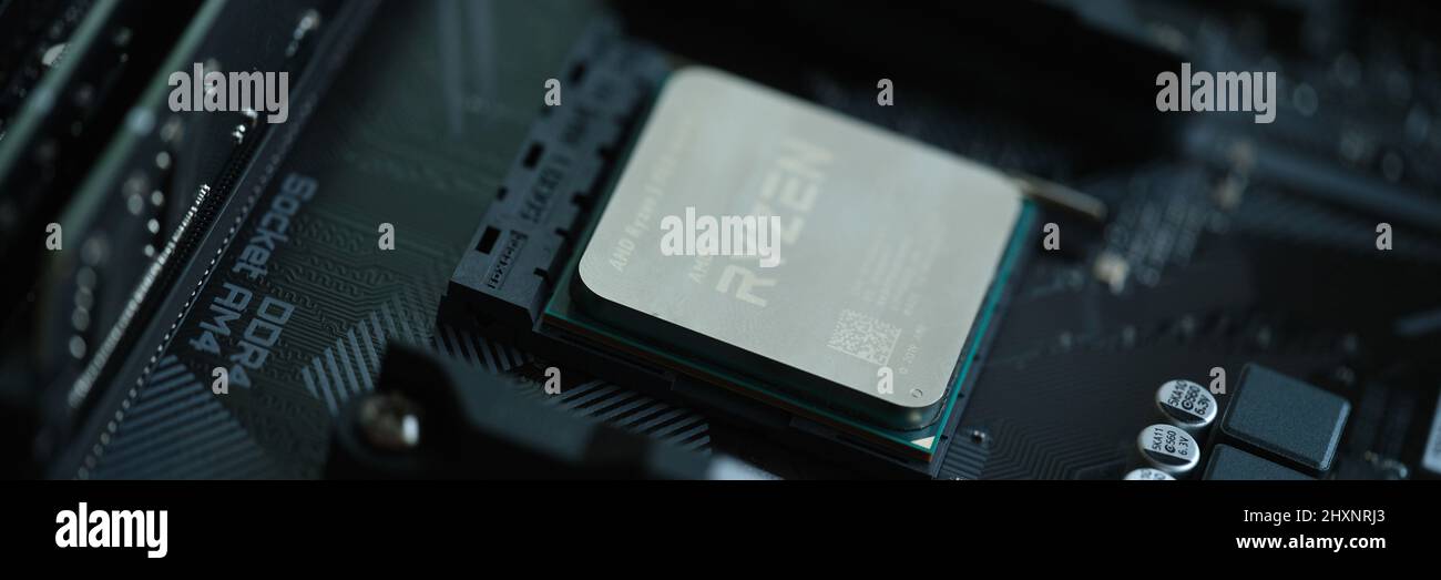 AMD Ryzen processor installed in motherboard slot AM4 closeup Stock Photo