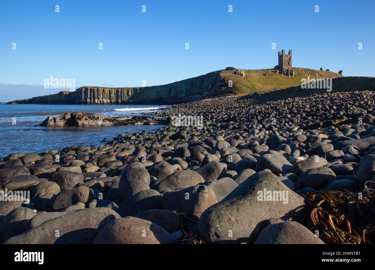 Dunstanburgh Castle and coast ,Northumberland,England Stock Photo