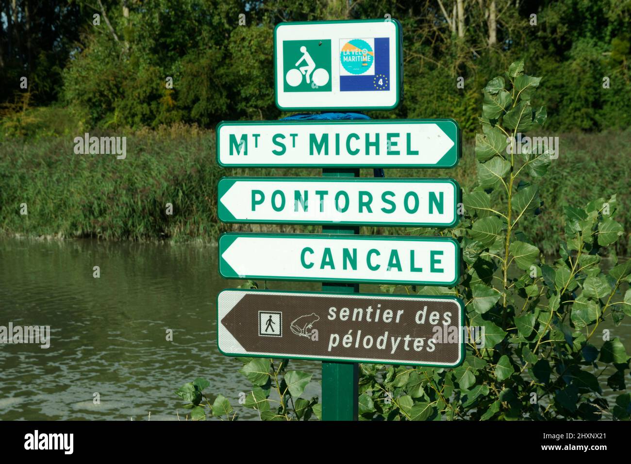Road signs (walking trails) along the Couesnon coastal river, near Moidrey (bay of Mont-Saint-Michel, Manche, Normandy, France). Stock Photo