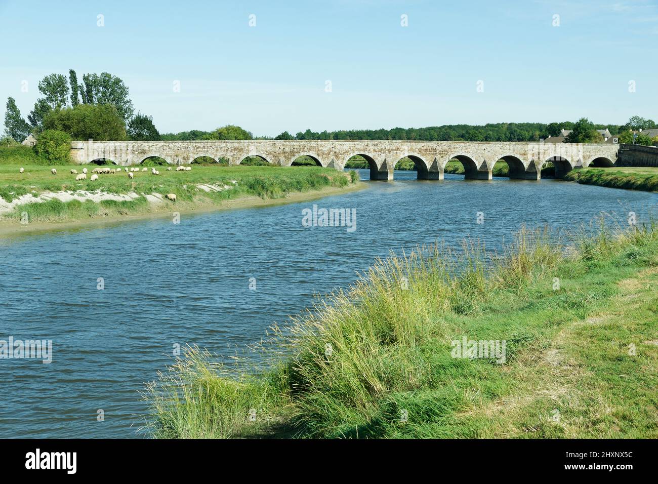 Coastal river the Sélune, historic bridge in Pontaubault (Bay of Mont-Saint-Michel, Manche, Normandy, France). Stock Photo