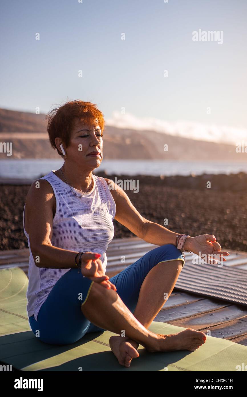 Women yoga bending over hi-res stock photography and images - Alamy