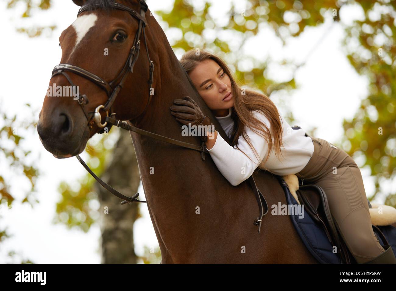 Beautiful young woman with horse outdoor. Concept of animal care. Rural rest and leisure. Idea of green tourism. Young european woman wearing uniform Stock Photo - Alamy Beautiful young woman with horse outdoor. Concept of animal care. Rural rest and leisure. Idea of green tourism. Young european woman wearing uniform Stock Photo - Alamy