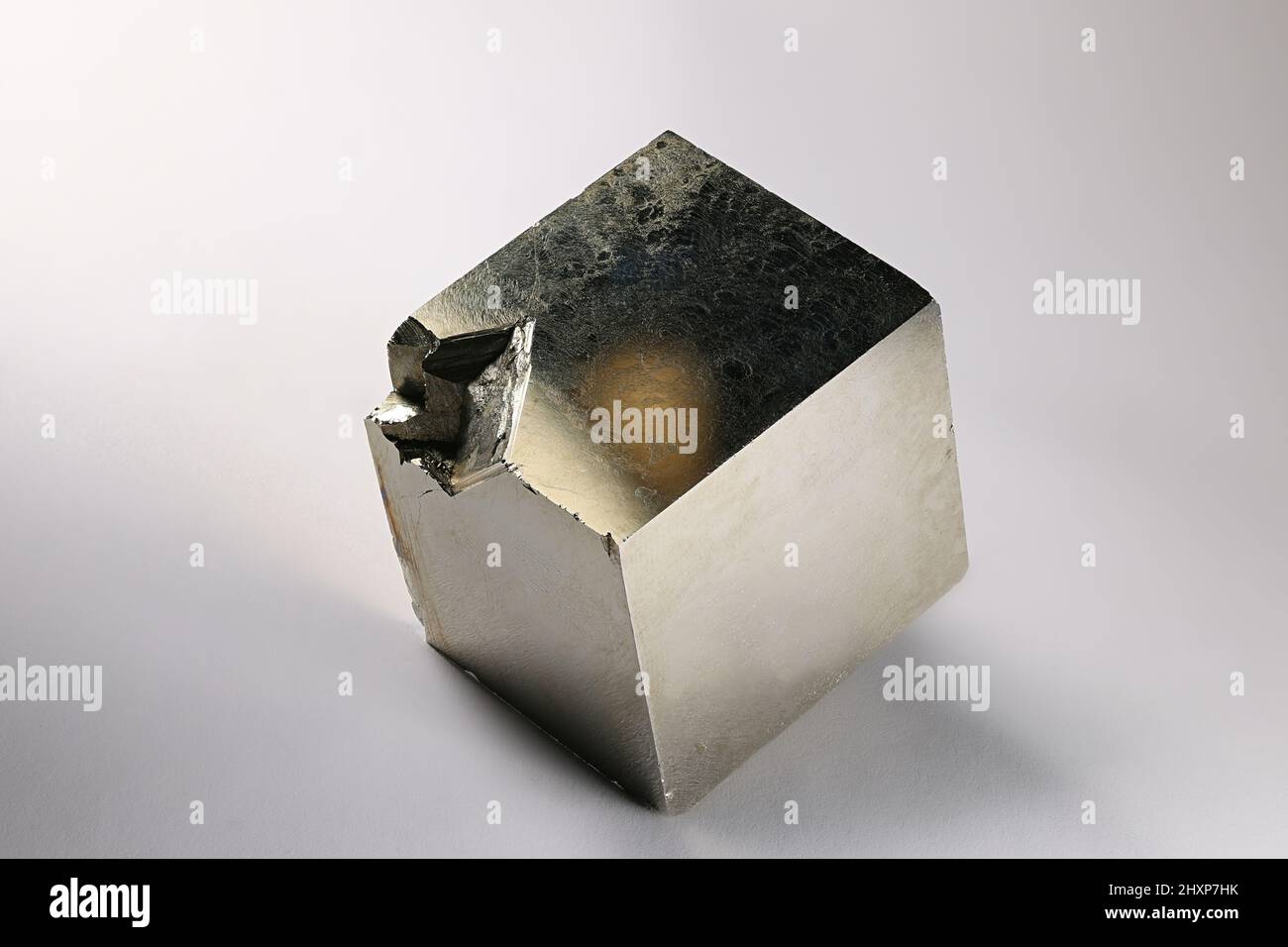Cubic crystal of pyrite. Pyrite is an iron sulfide and the most abundant sulfide mineral. Stock Photo