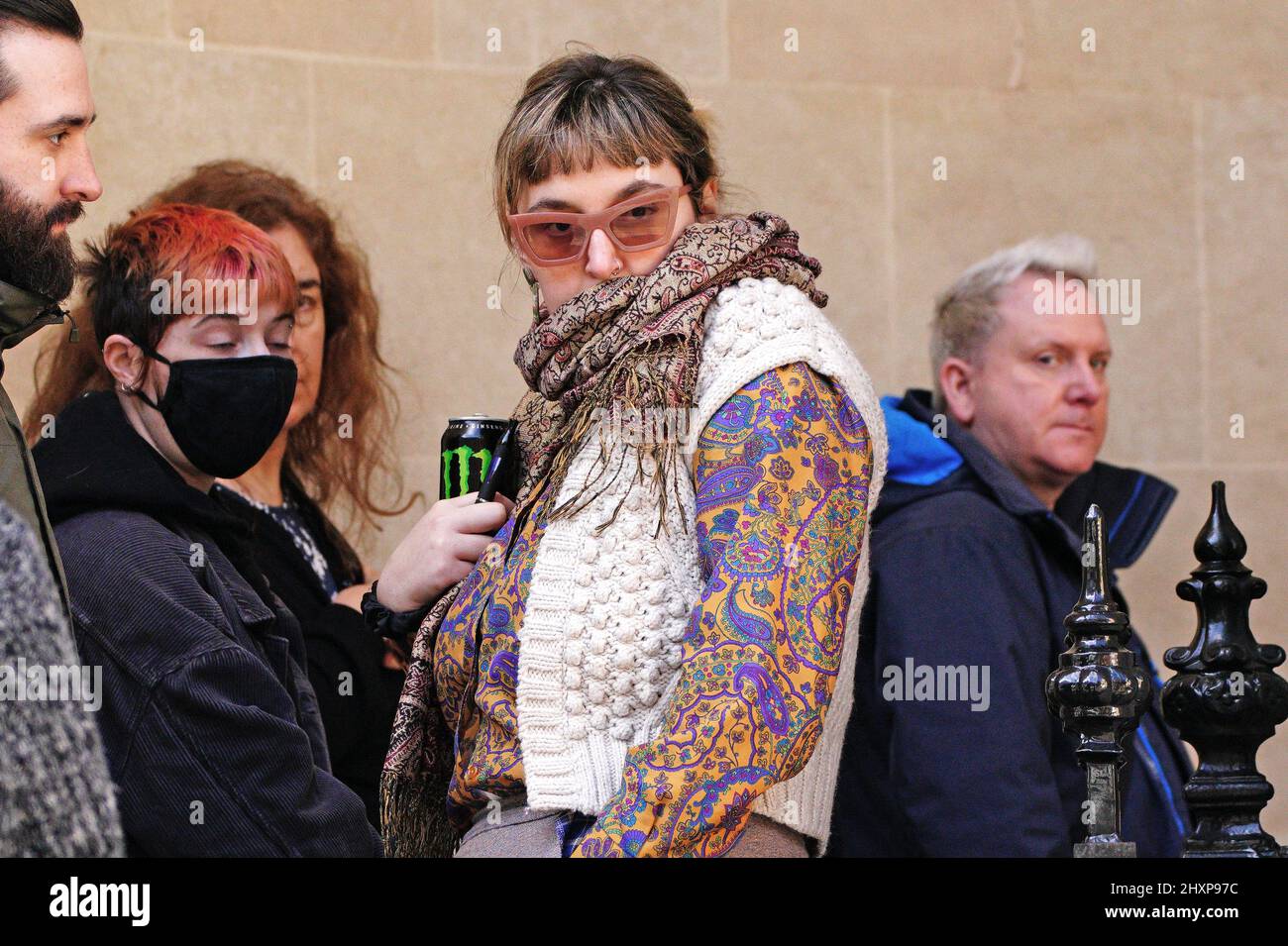 Jasmine York (centre) arrives at Bristol Crown Court for sentencing. York, 26, live streamed the protest from her phone and was also filmed helping to push a bin towards a burning police car - seemingly to add fuel to the blaze during the Kill the Bill protests in Bristol in March 2021. Picture date: Monday March 14, 2022. Stock Photo