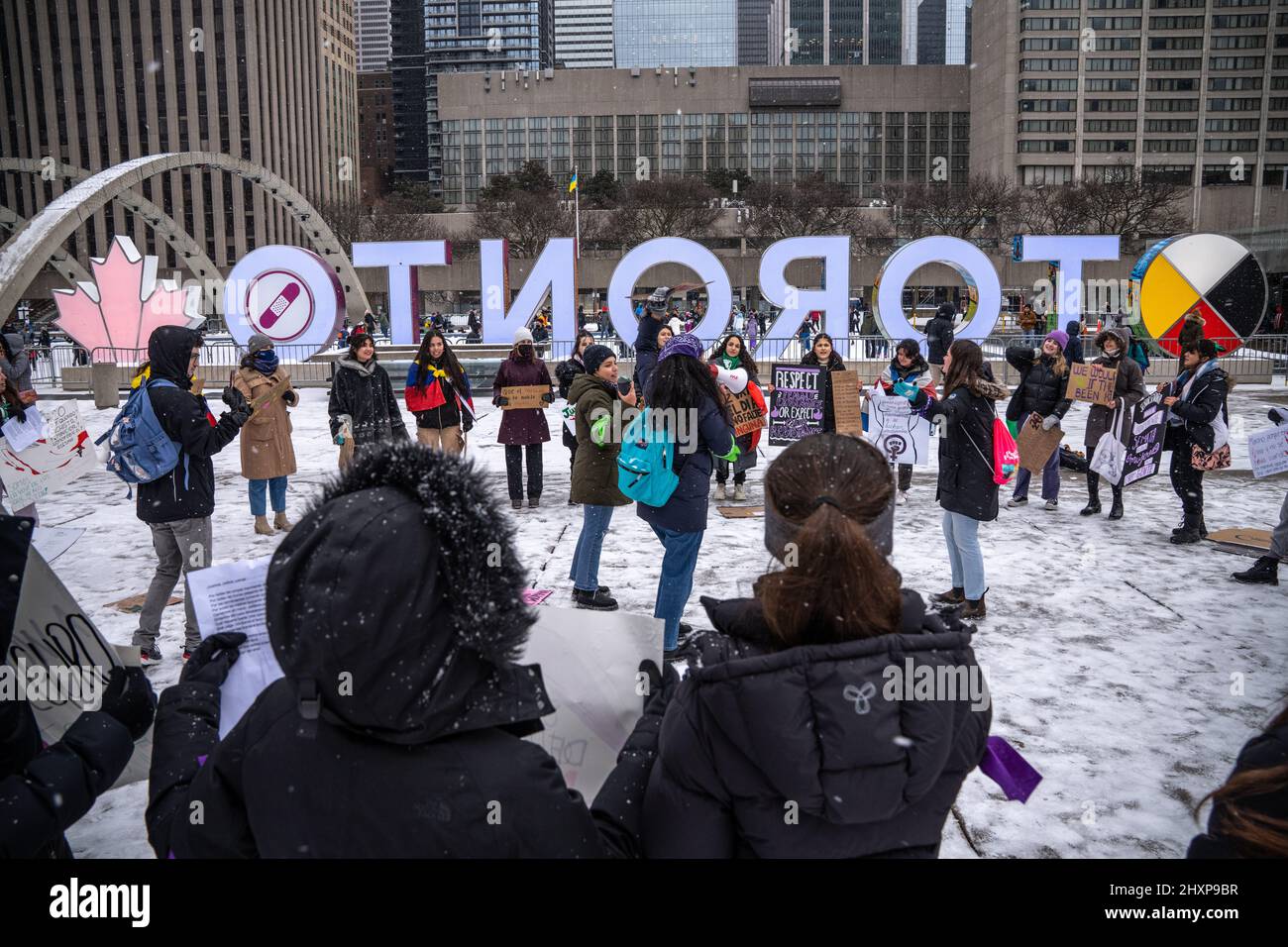 Toronto, Canada. 13th Mar, 2022. Protesters seen listening to speeches ...