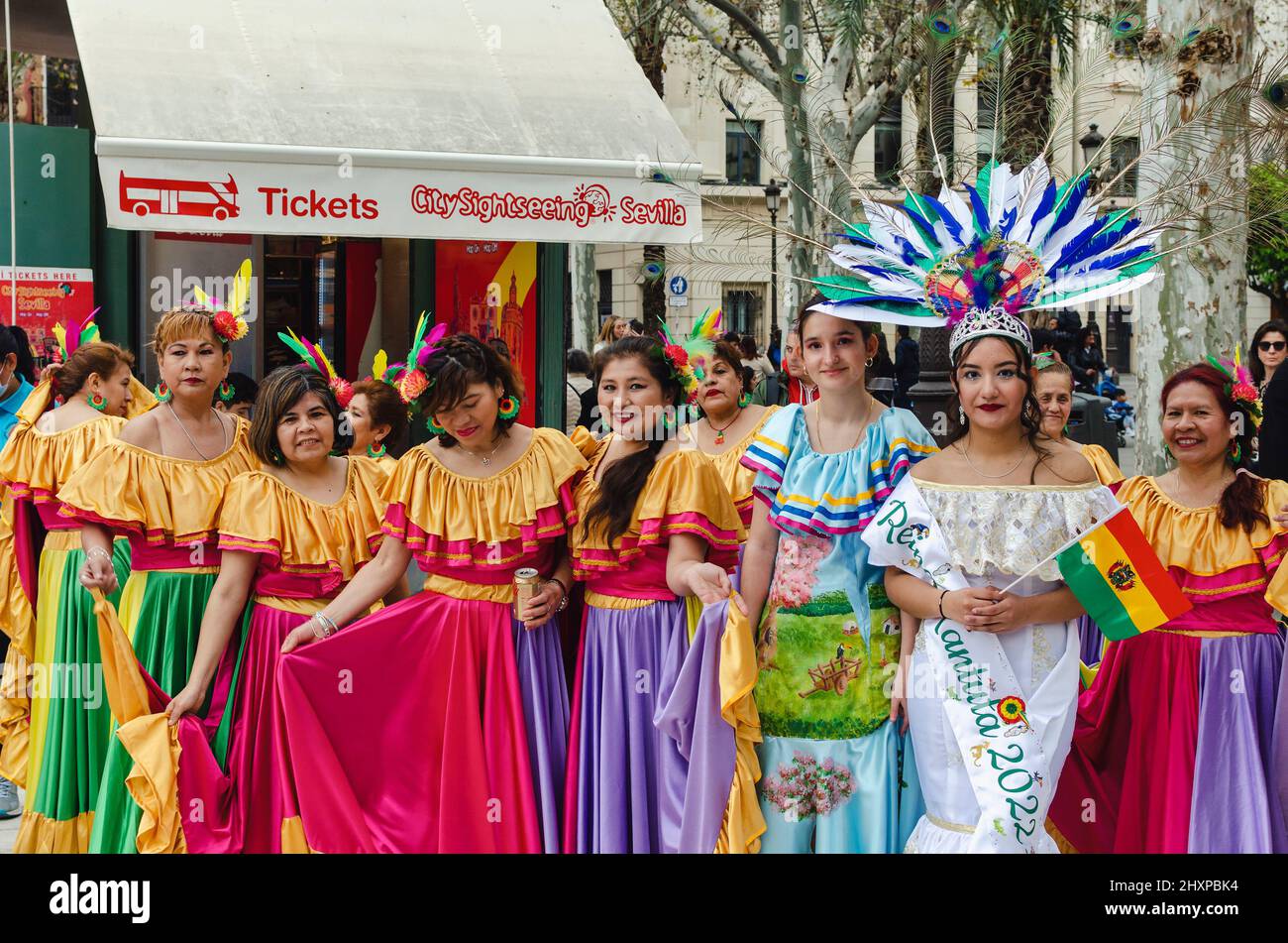 Seville, Spain; March 12, 2022: Group of women wearing traditional costumes during the bolivian carnival. Stock Photo