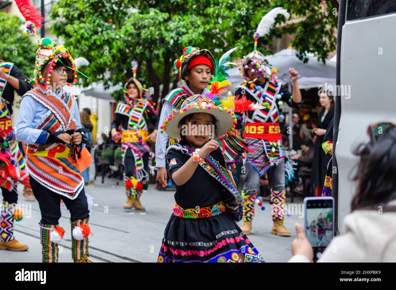 Seville, Spain; March 12, 2022: Young people dancing during the bolivian carnival Stock Photo
