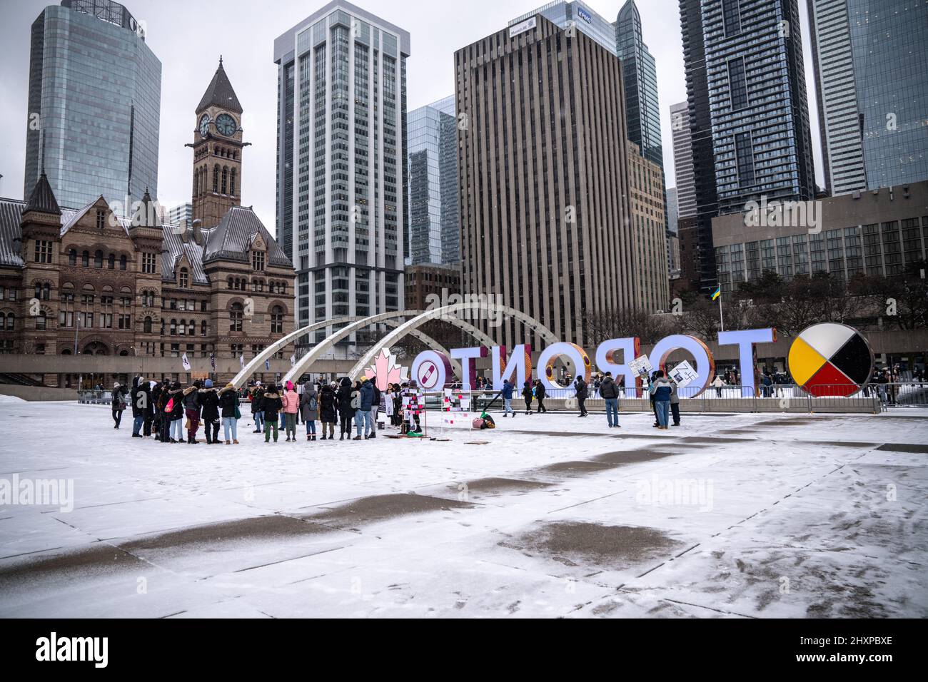 Protester seen gathering in front of a “Toronto” sign during the women ...