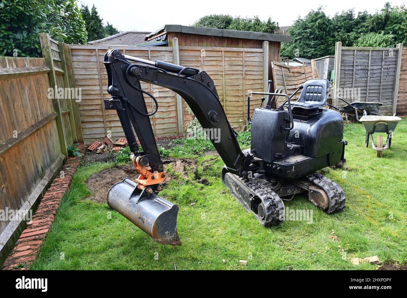Garden Rigs A small garden digger parked ready for use Stock Photo - Alamy