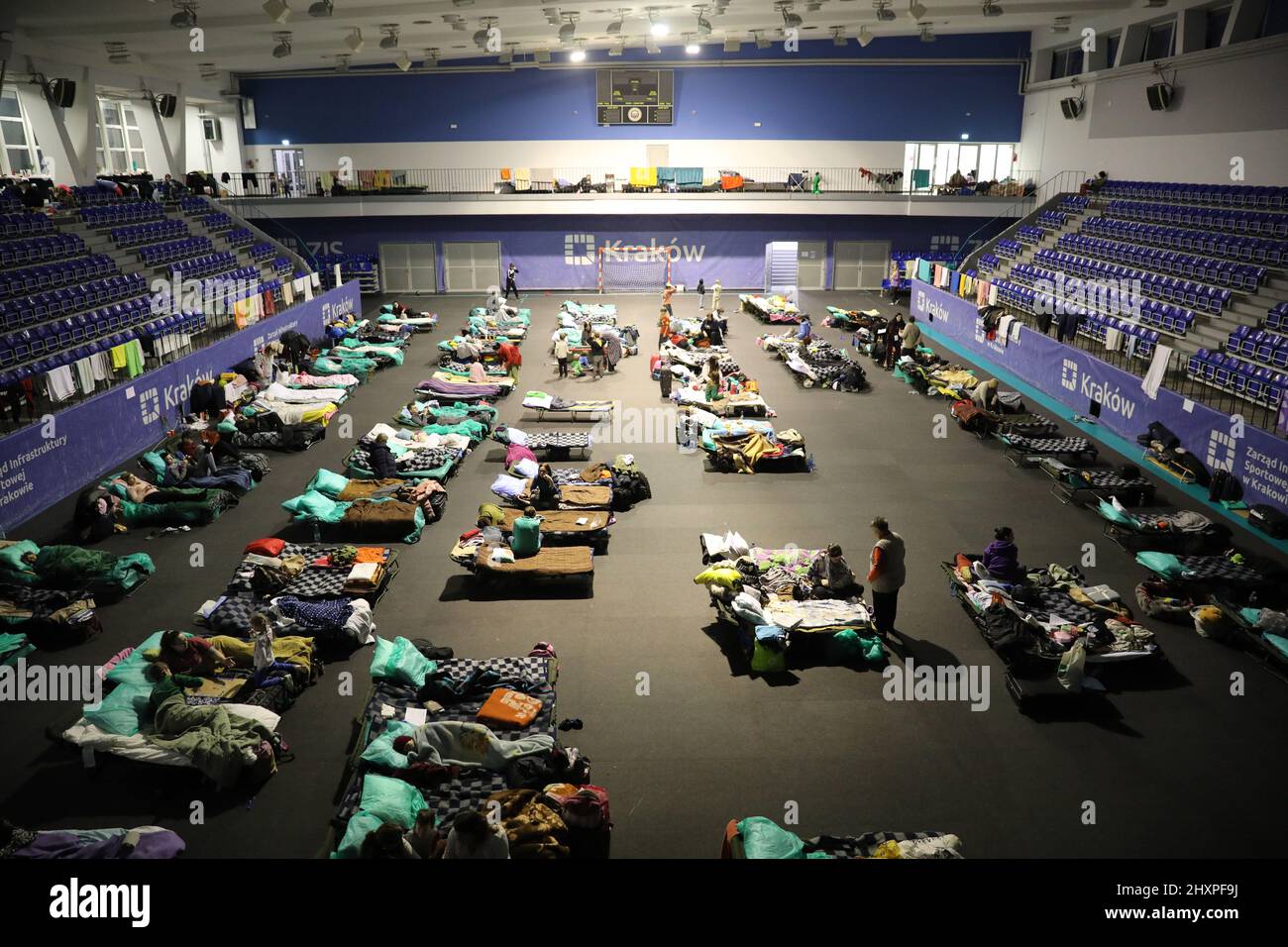 KRAKOW, POLAND - MARCH 9, 2022: Ukrainian refugees at the Suche Stawy (football club Hutnik Krakow Arena) in Cracow Stock Photo