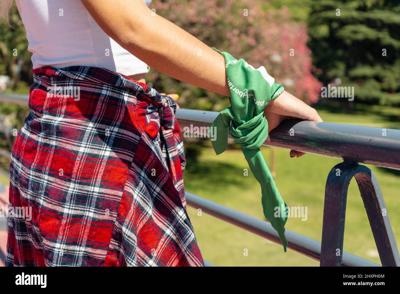 Fist with a green scarf symbolizing the feminist struggle for equality and legal abortion in Latin America. Legal, safe and free abortion. Concept of Stock Photo