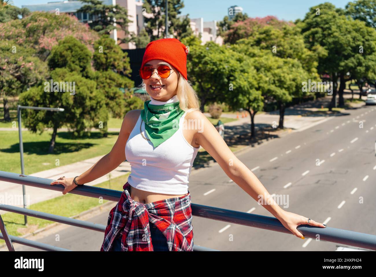 Beautiful young activist woman with a green scarf symbolizing the feminist fight for equality and legal abortion in Latin America. Legal, safe and fre Stock Photo