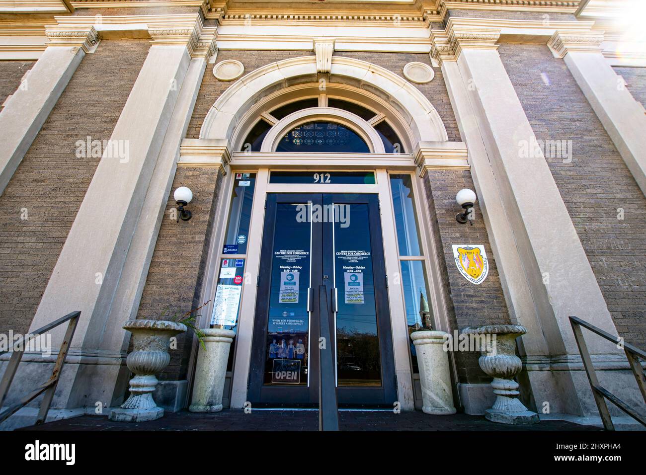Selma, Alabama, USA-March 1, 2022: Entrance doors of the Selma and Dallas County Centre for Commerce located in the historic Carnegie Library building Stock Photo