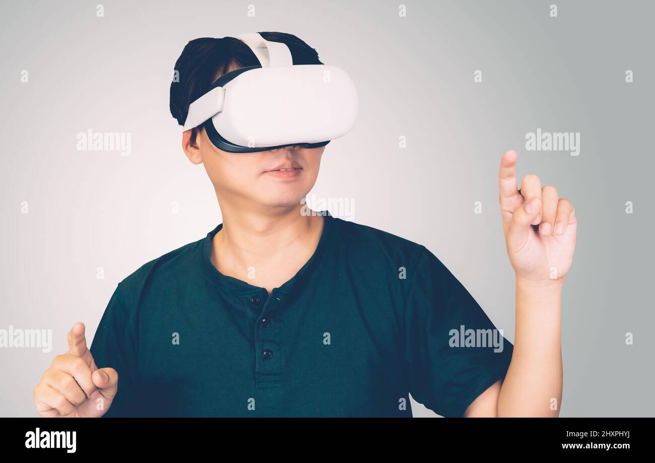 Portrait of young asian man wearing goggles virtual reality with ...