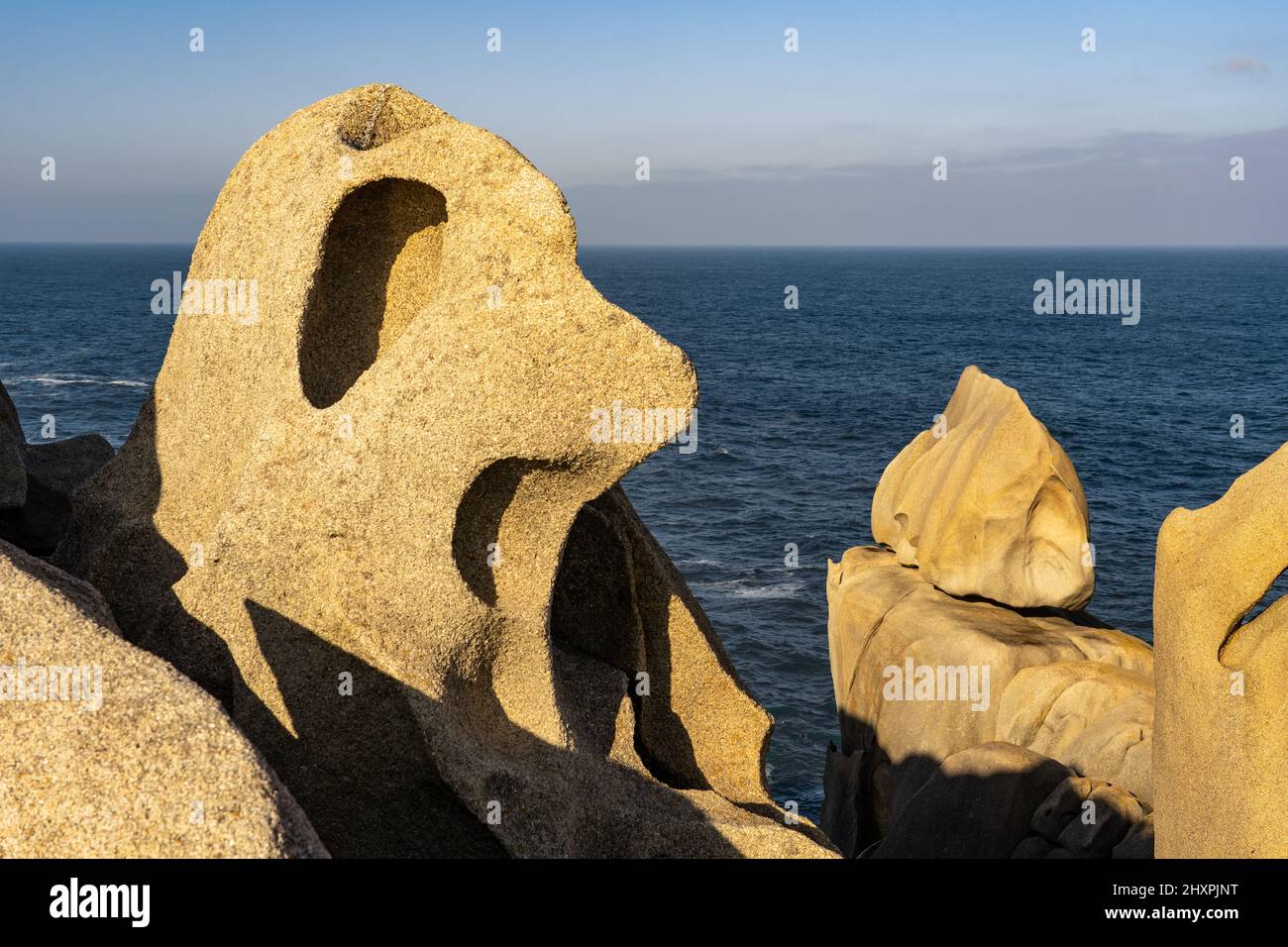 Acantilados de papel (Paper cliffs) in the Rías Altas zone in Gaiicia at sunset with sinuous rock formations. Stock Photo