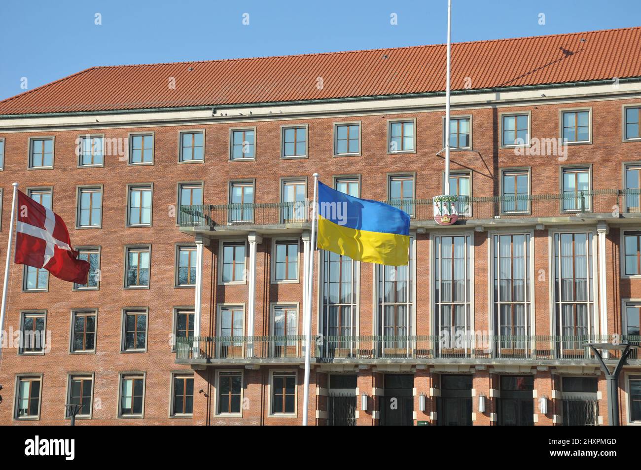 Frederiksberg/Copenhagen/Denmark.14.March 2022/Ukrainian lag along with danish flag fly in yard of Frederiksberg town hall to pay respect to Ukrainian people thier war against Russia and urkianian nation..    (Photo..Francis Dean/Dean Pictures) Stock Photo