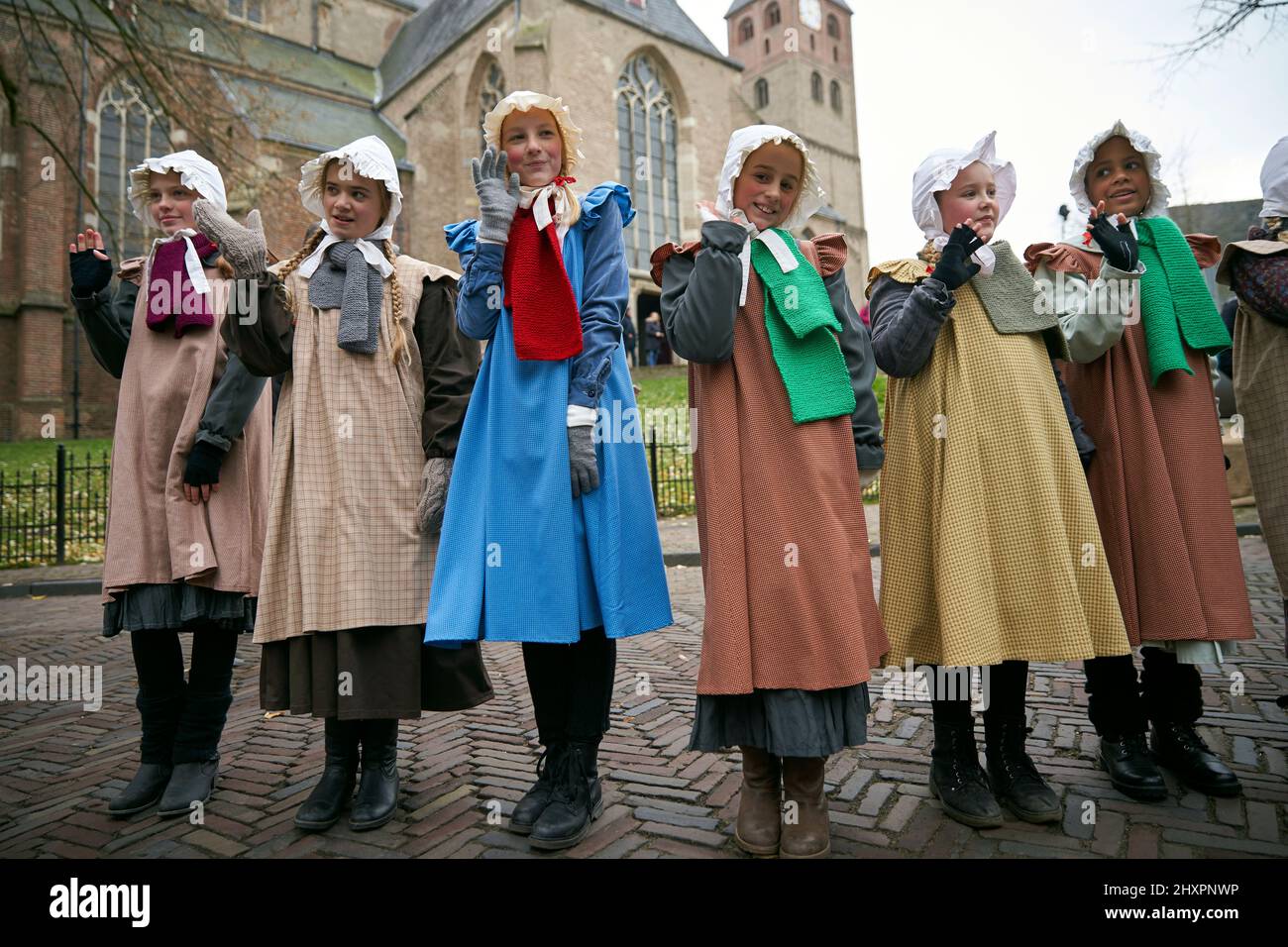 A group of girls greet the public disguised as schoolgirls Stock Photo