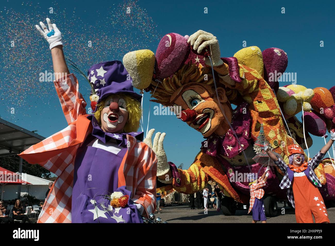 The float Clowning around during the parade in Zundert Stock Photo