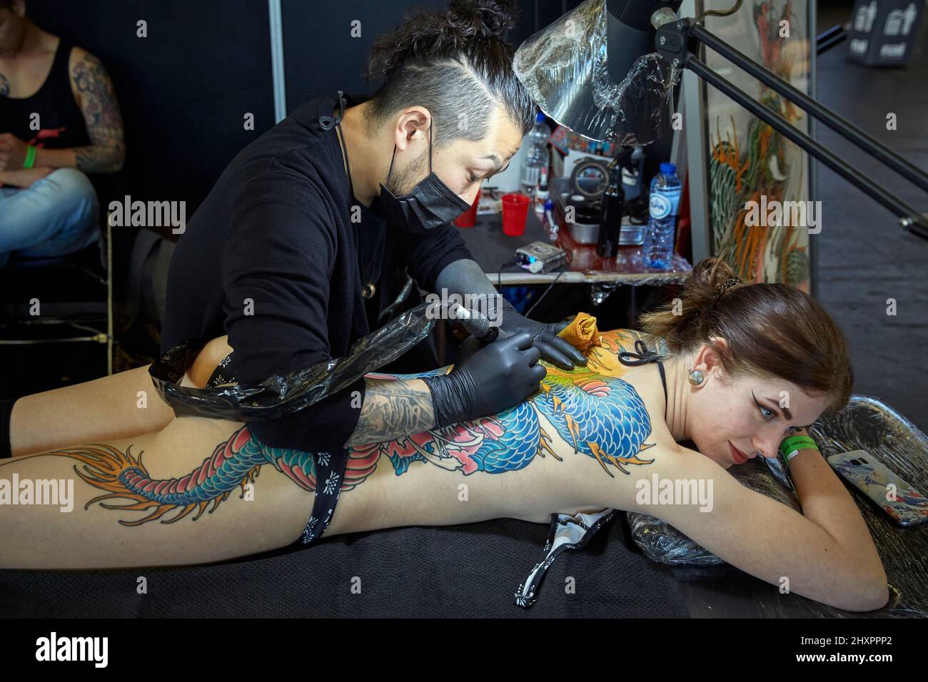 Some of the tattoo artists participating in the event making some of their designs in Amsterdam Stock Photo