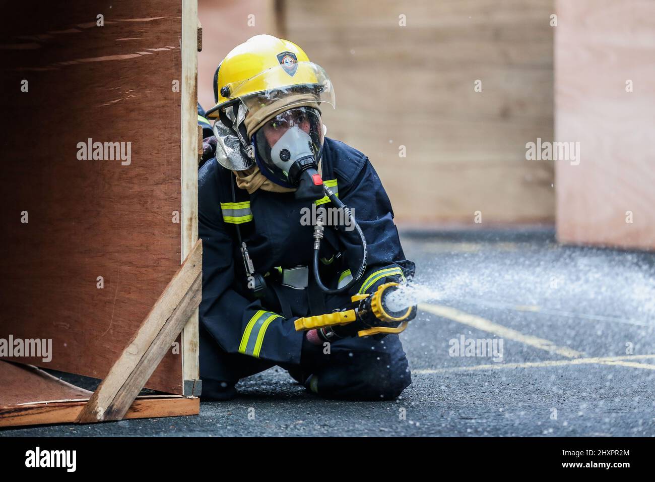 Quezon City. 14th Mar, 2022. A female firefighter participates in the Women Firefighters Skills Olympics at the Philippine Bureau of Fire Protection-National Capital Region (BFP-NCR) headquarters in Quezon City, the Philippines on March 14, 2022. The Philippine Bureau of Fire Protection (BFP) held its Women Firefighters Skills Olympics as part of the observance of the National Women's Month and the Fire Prevention Month to show the skills of their female personnel in extinguishing fires, emergency response, and rescue capabilities. Credit: Rouelle Umali/Xinhua/Alamy Live News Stock Photo