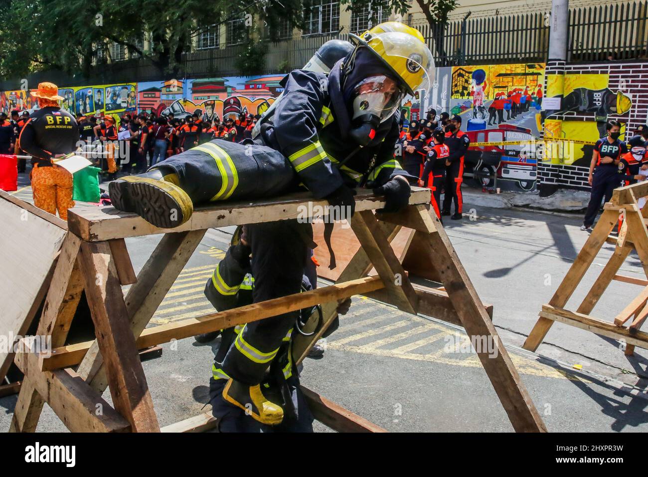 Quezon City. 14th Mar, 2022. A female firefighter participates in the