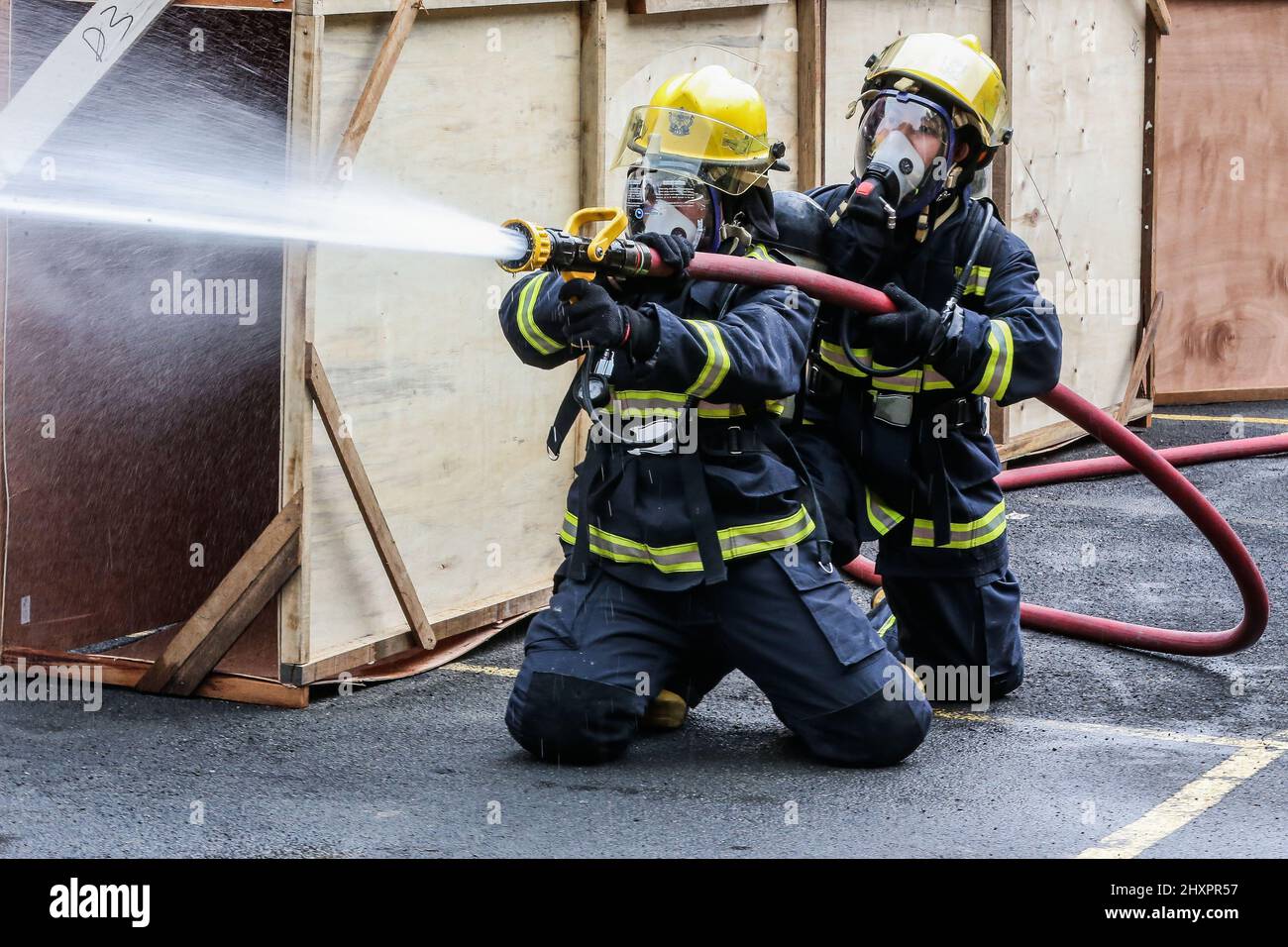 Quezon City. 14th Mar, 2022. Female firefighters participate in the Women Firefighters Skills Olympics at the Philippine Bureau of Fire Protection-National Capital Region (BFP-NCR) headquarters in Quezon City, the Philippines on March 14, 2022. The Philippine Bureau of Fire Protection (BFP) held its Women Firefighters Skills Olympics as part of the observance of the National Women's Month and the Fire Prevention Month to show the skills of their female personnel in extinguishing fires, emergency response, and rescue capabilities. Credit: Rouelle Umali/Xinhua/Alamy Live News Stock Photo