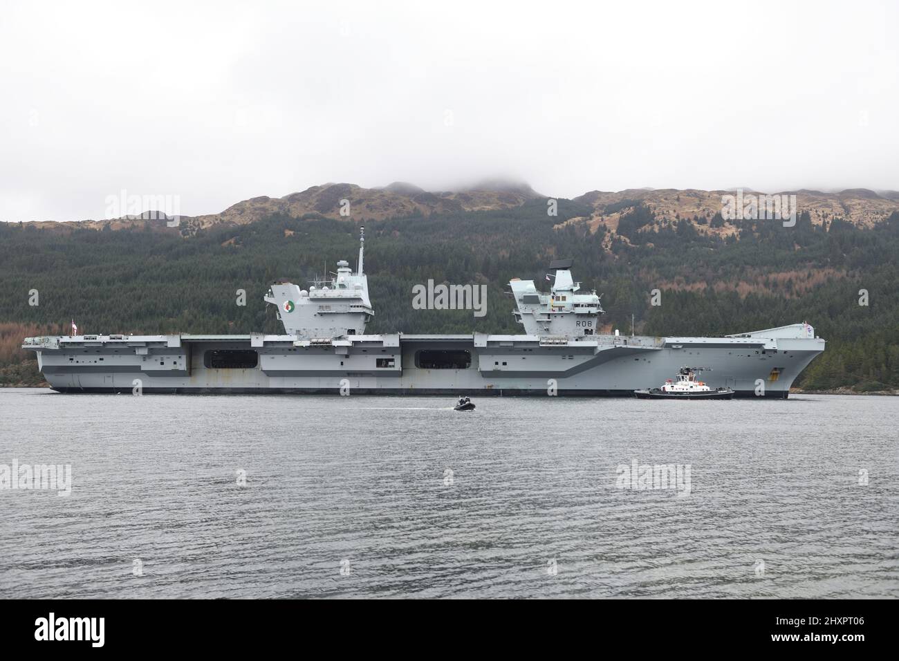 14th, March, 2022. Glenmallan, Scotland, UK. HMS Queen Elizabeth visits Glenmallan on Loch Long on a logistics visit and to continue training. GPS operation and air space restrictions are in place due to the ship being on high alert. Credit. Douglas Carr/Alamy Live News Stock Photo