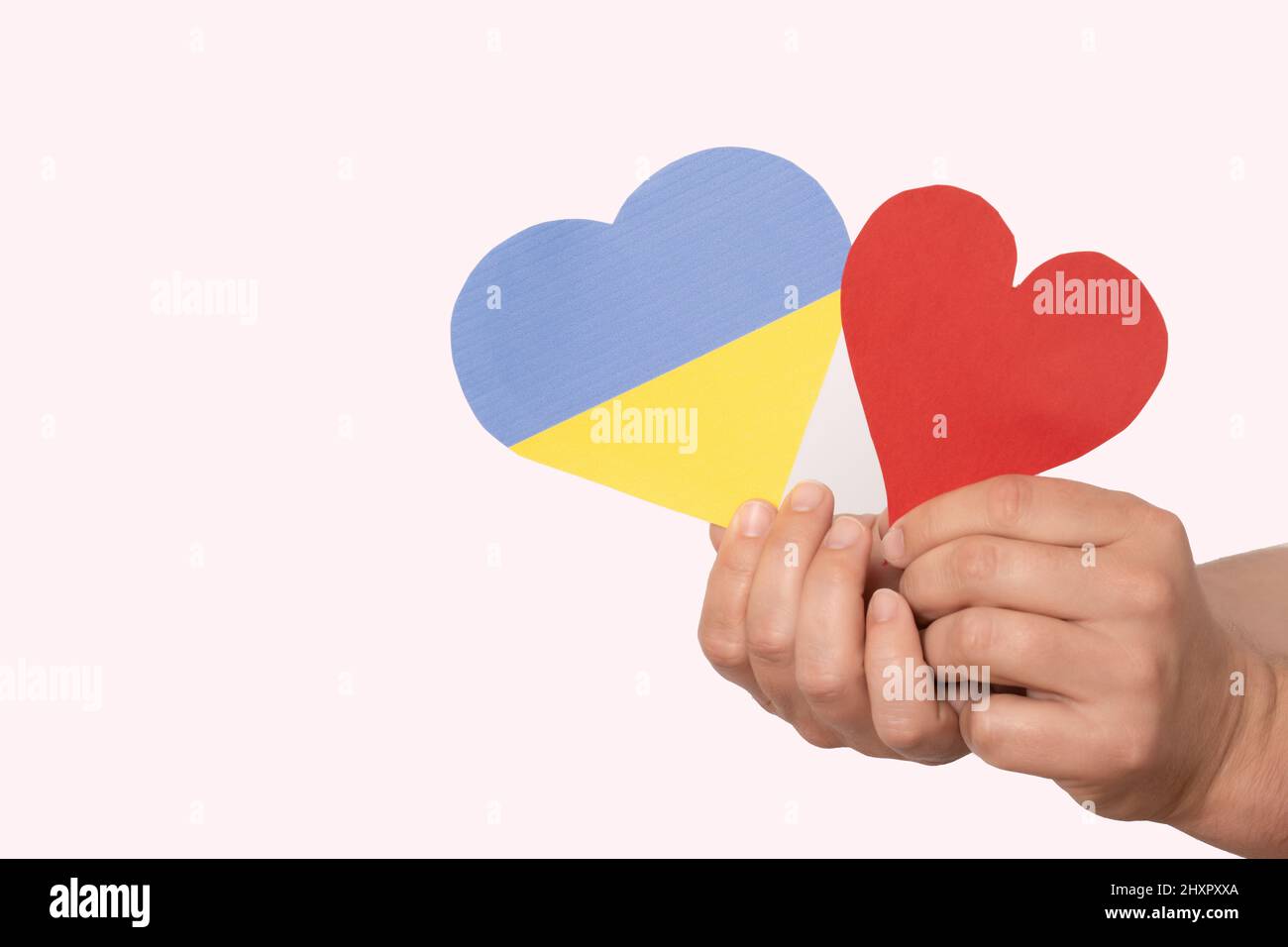 Hands holding paper red hi-res stock photography and images - Alamy