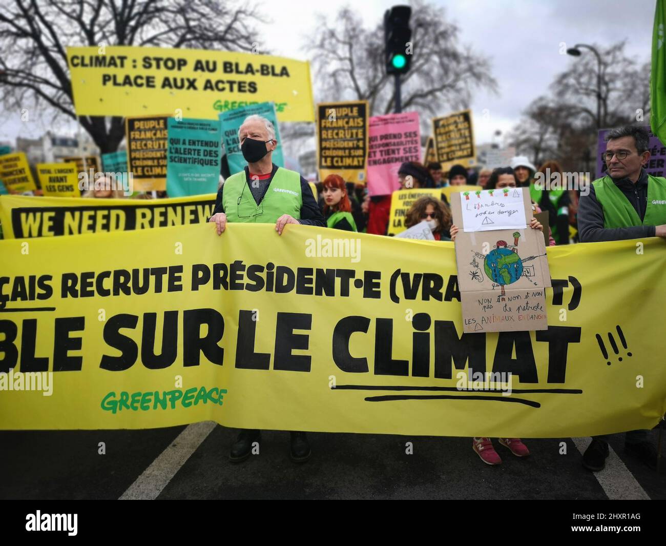 Greenpeace activists protesting for peace and environment at the Climate March in Paris France, on March 13, 2022 Stock Photo