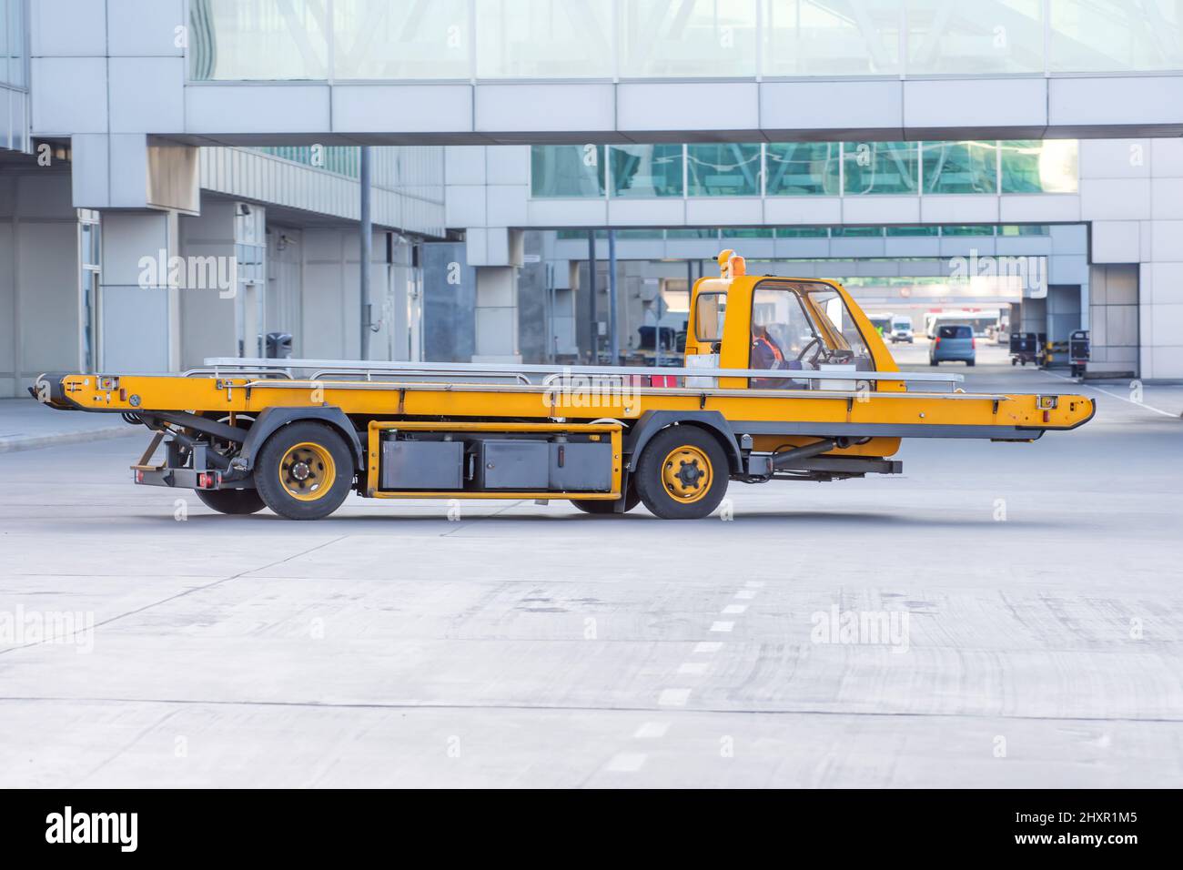 Cargo equipment car loader for luggage in the airport hub Stock Photo