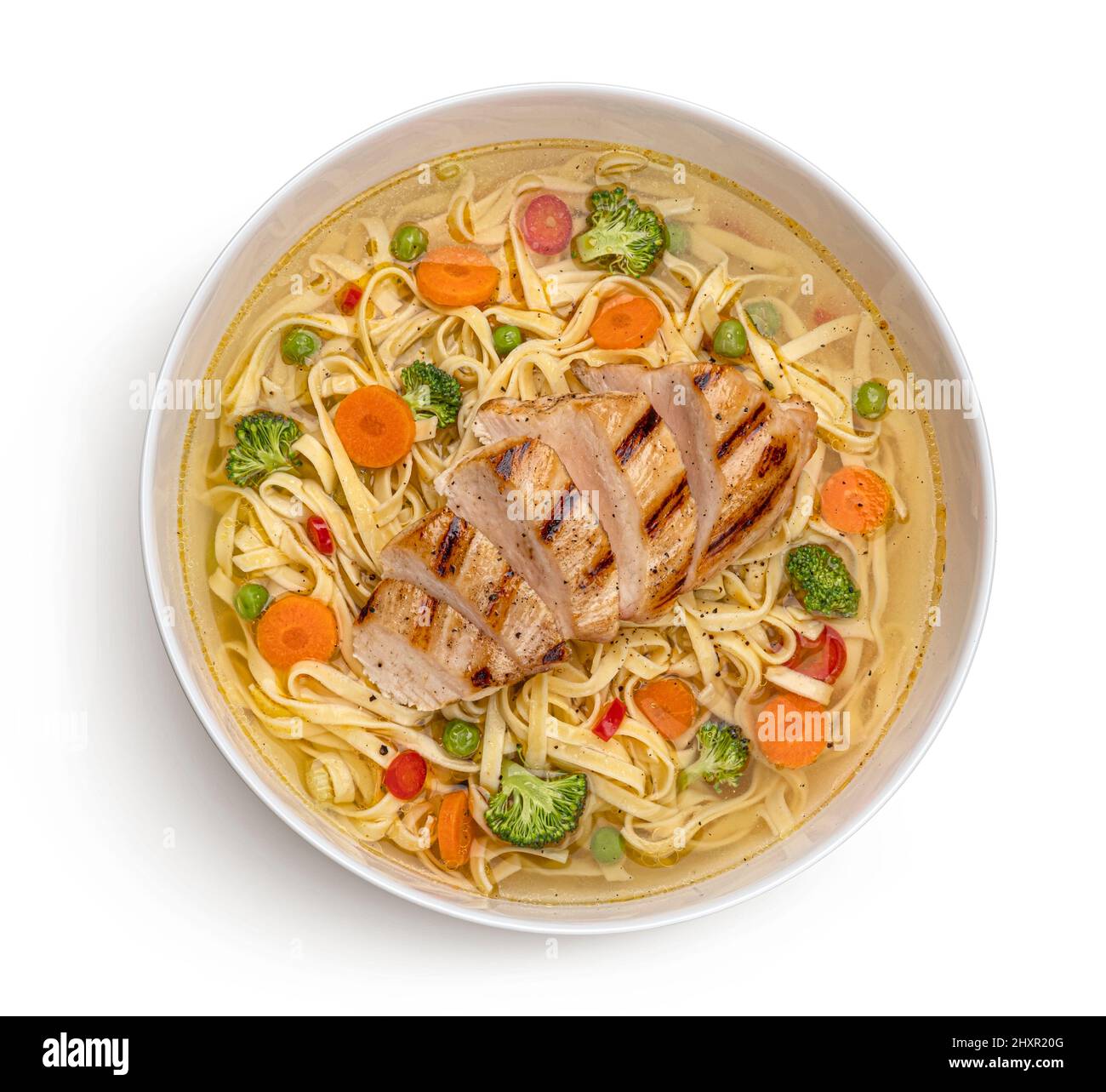Udon noodles with grilled chicken, instant soup with vegetables Stock Photo