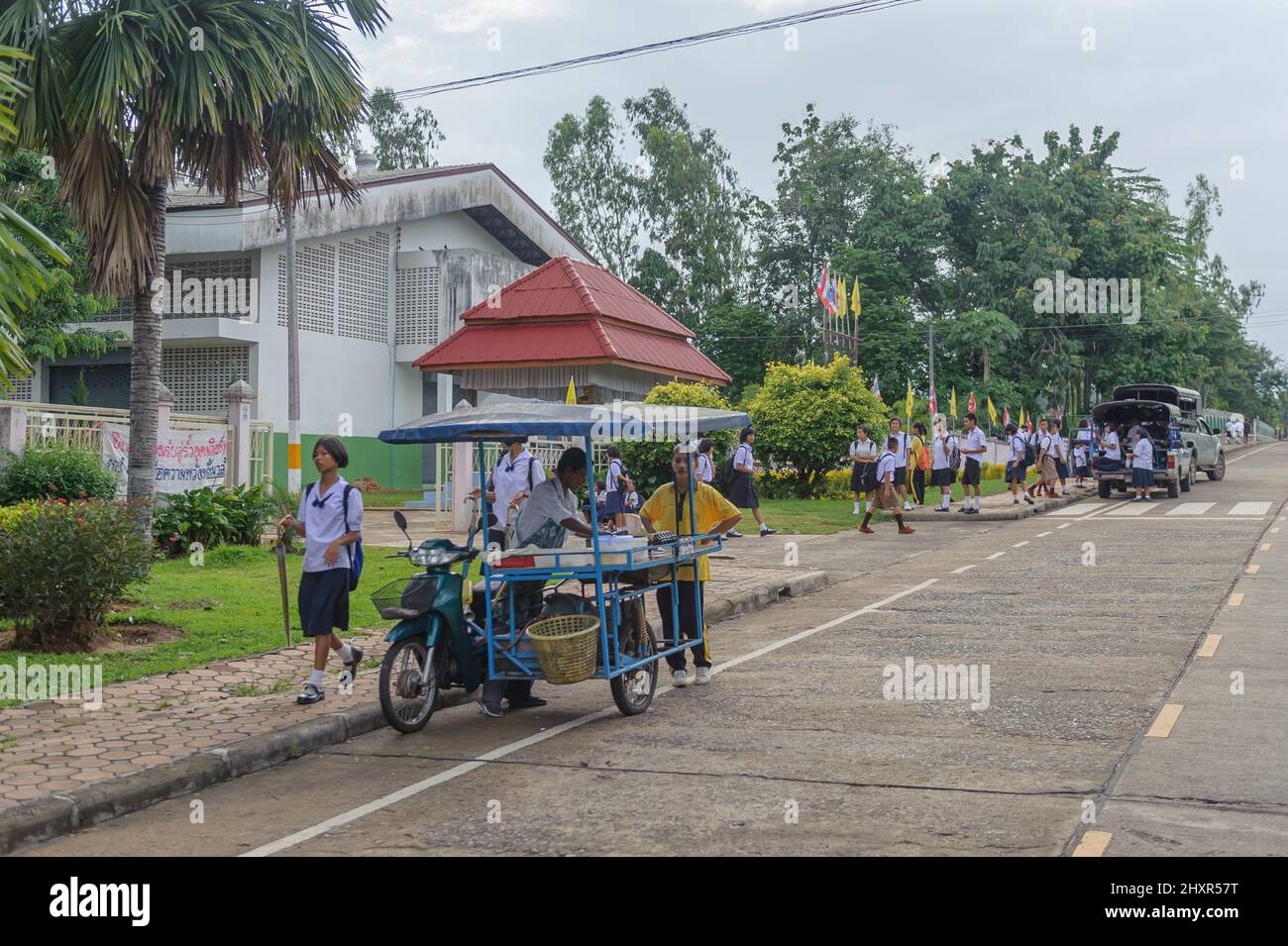 Secondary students leaving Udomsit Suksa School, Nong Lu, Sangkhla Buri District, Kanchanaburi, Thailand Stock Photo