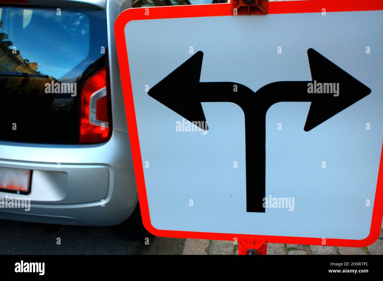 Traffic Signs in front of crossroad, Direction turn left or turn Stock